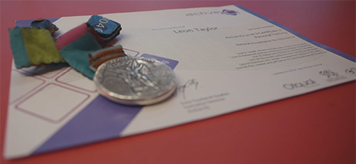 Leon's Olympic medal and Active IQ certificate